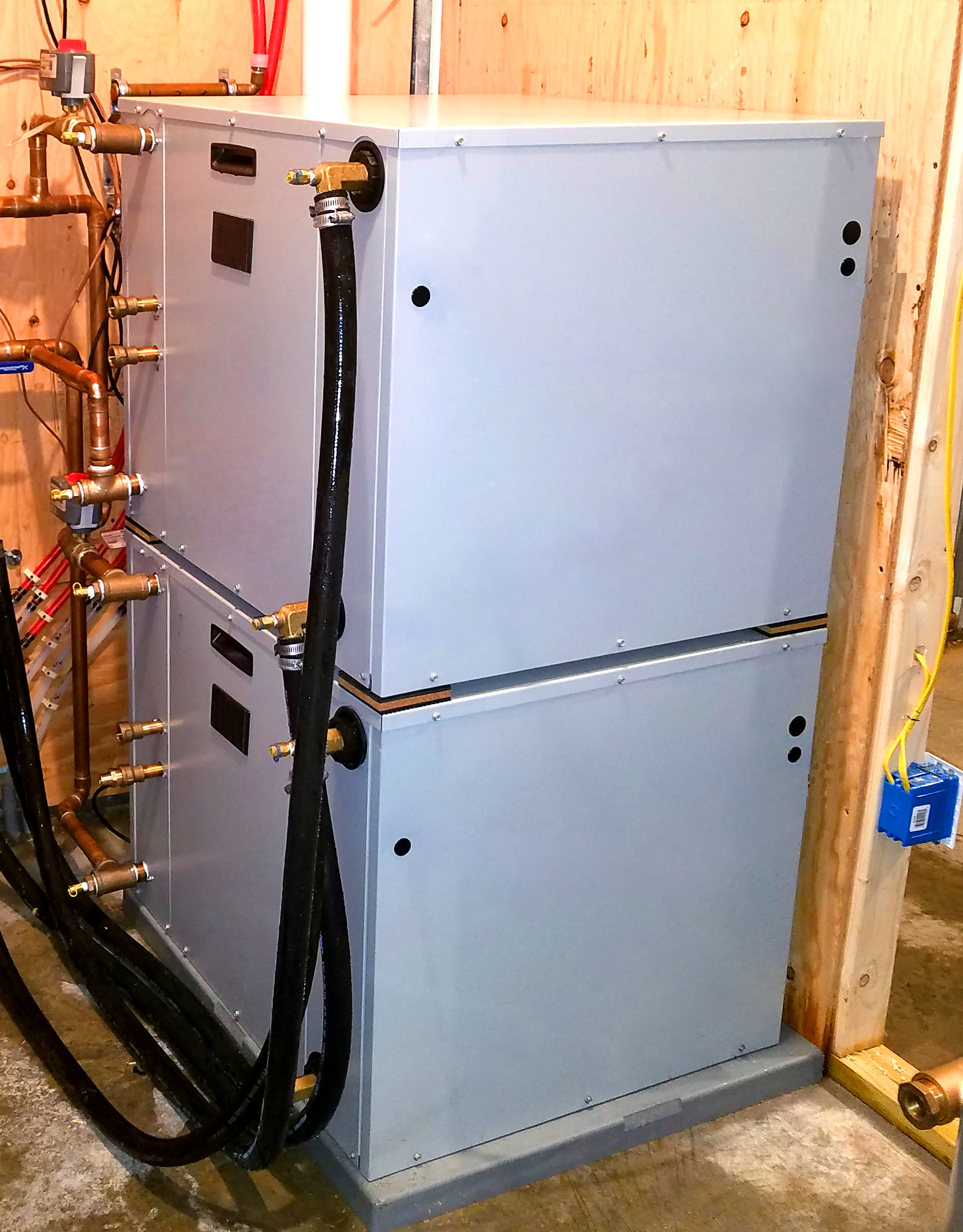 Stacked water-to-water geothermal heat pumps